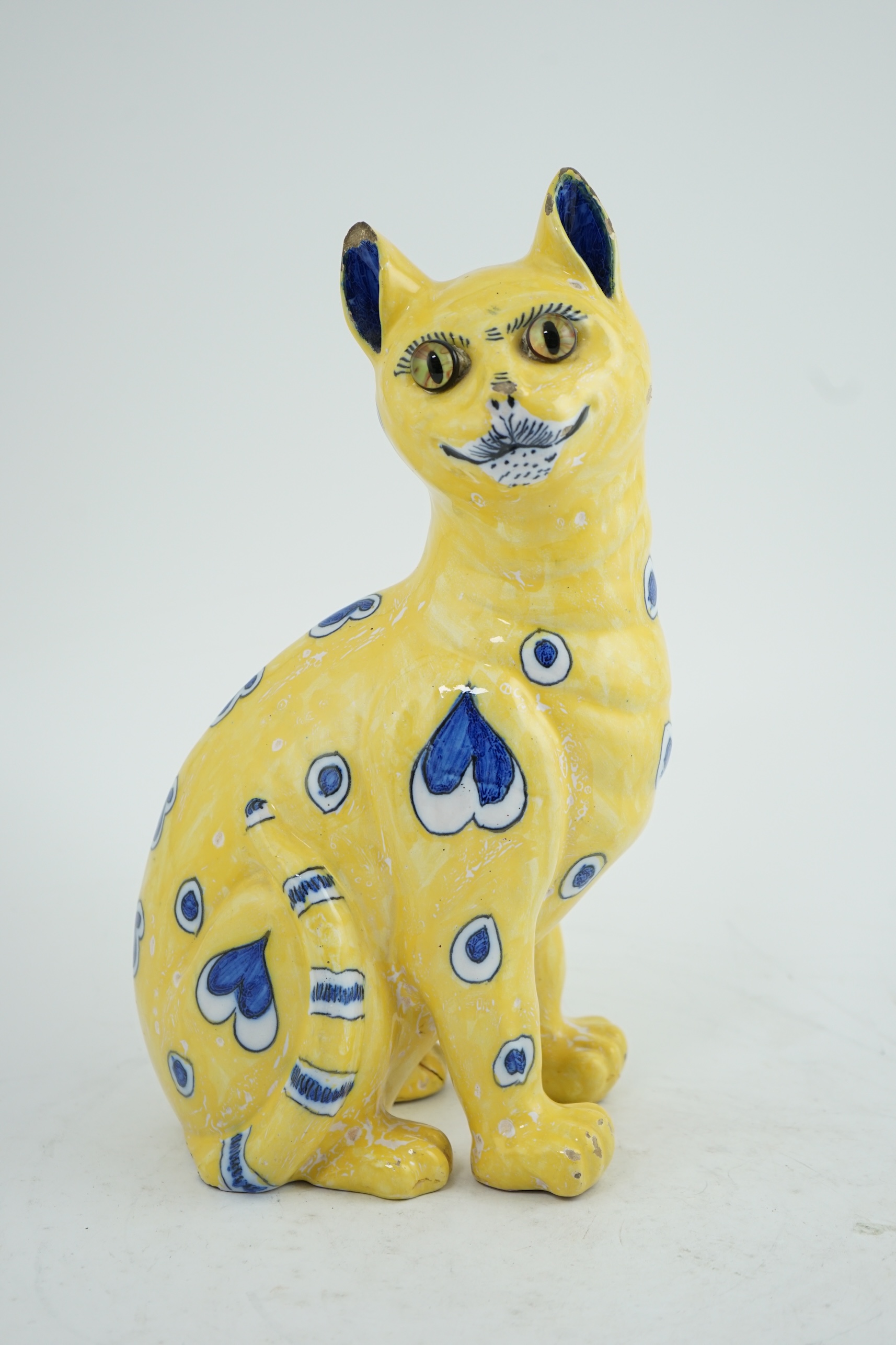 A Gallé yellow faience model of a seated smiling cat, c.1885